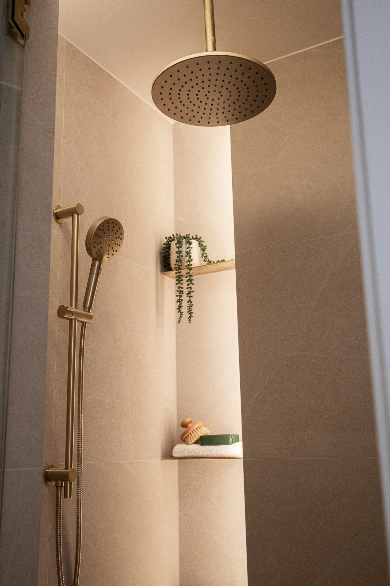 Rainhead shower with brushed brass fittings